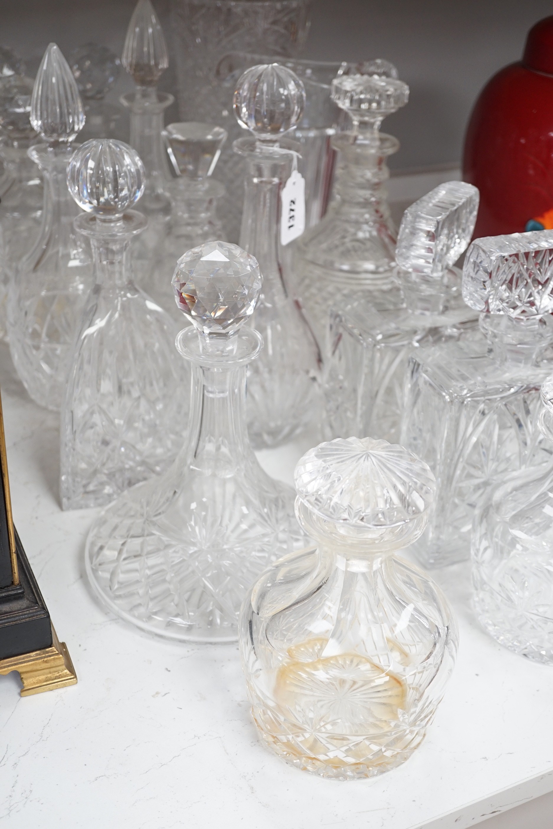 A group of assorted glass decanters and two vases